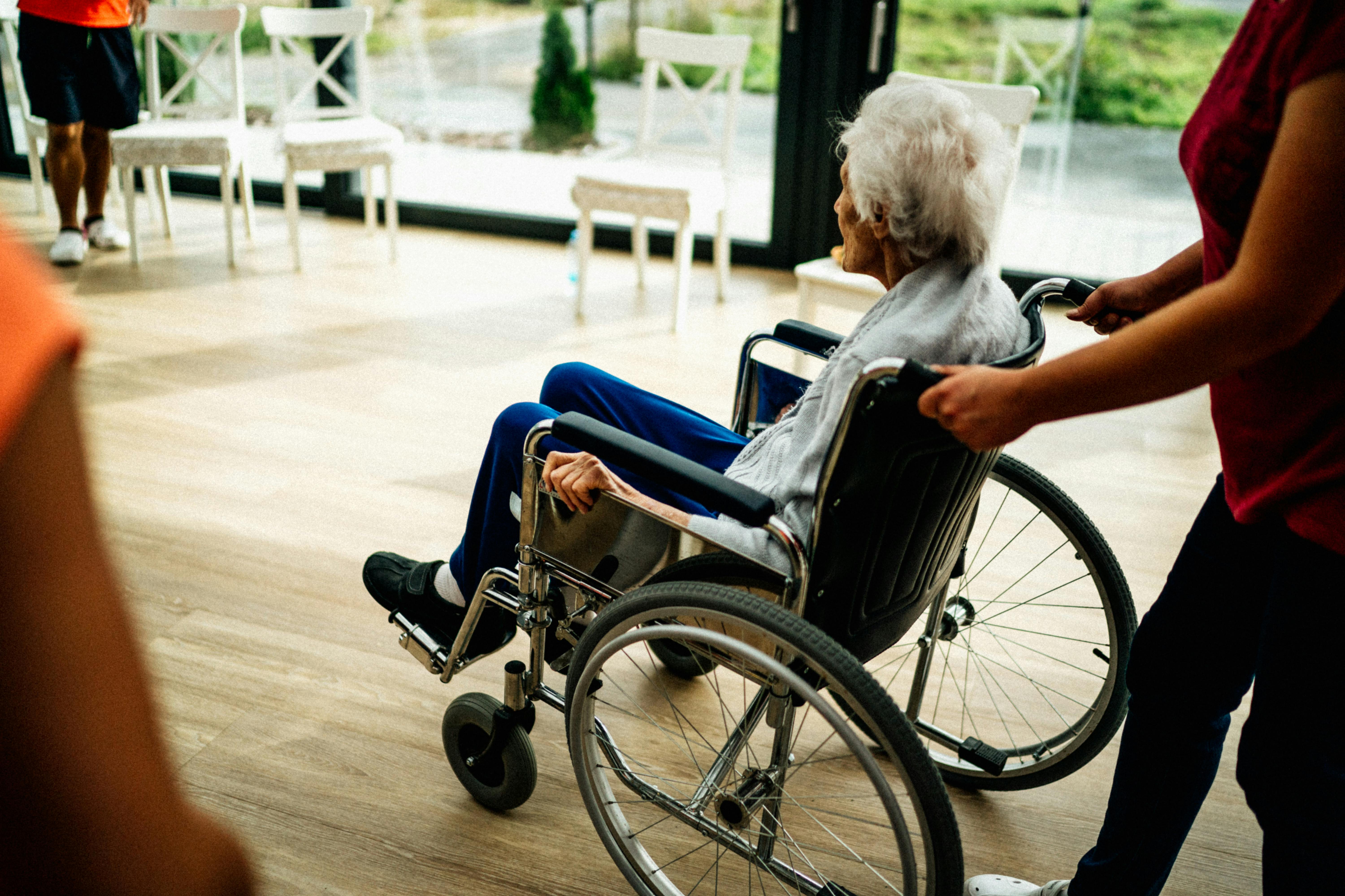 A resident supported and mobile in her wheelchair.