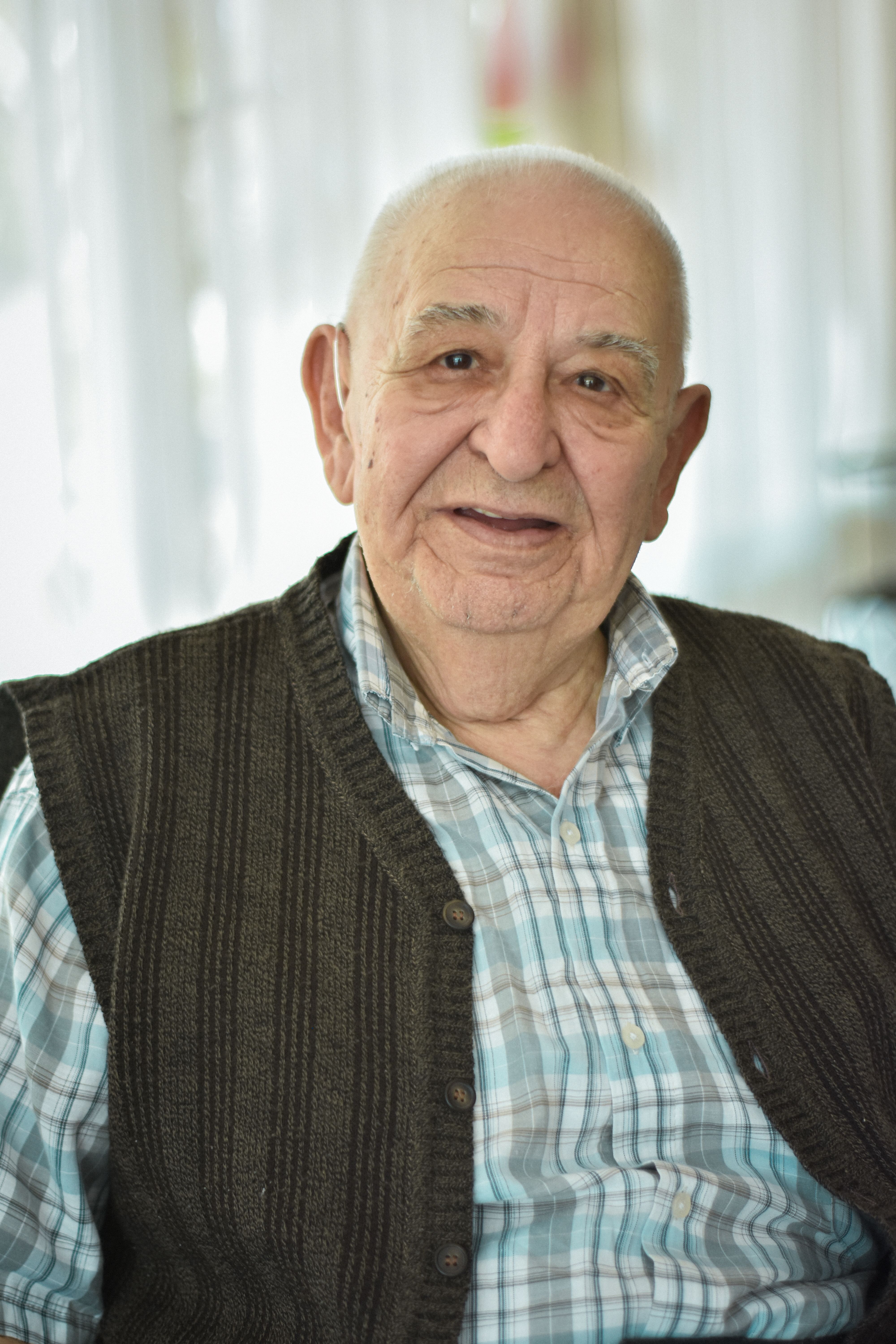 A senior wearing the SeniorConnex biometric watch at home.